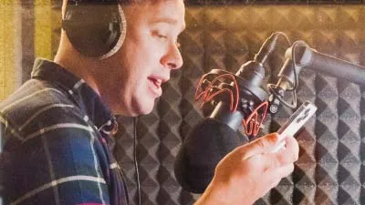 Podcast.co founder James Mulvany  in the recording booth practicing his introduction